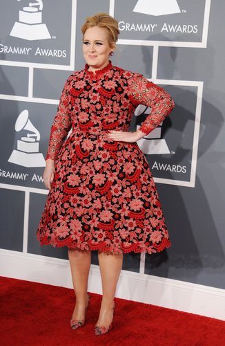 Adele posed on the Grammys red carpet in a Valentino dress.
Adele posed on the Grammys red carpet in a Valentino dress.