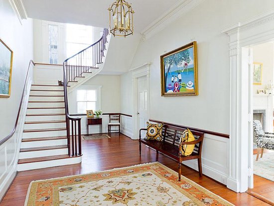 The foyer features an elegant chandelier, a traditional rug, and eye-catching artwork hung over a simple wooden bench — and if it were truly Noah's house, we're willing to bet he'd have built the bench himself.
Source: Sotheby's
The foyer features an elegant chandelier, a traditional rug, and eye-catching artwork hung over a simple wooden bench — and if it were truly Noah's house, we're willing to bet he'd have built the bench himself.
Source: Sotheby's