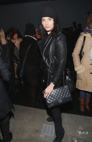 Model Crystal Renn looked slick in all black — leather jacket, beanie, and quilted Chanel purse — at Helmut Lang.
Model Crystal Renn looked slick in all black — leather jacket, beanie, and quilted Chanel purse — at Helmut Lang.