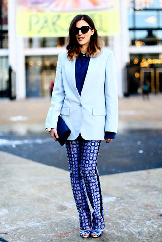 This showgoer braved the snow in strappy heels and printed pants.
This showgoer braved the snow in strappy heels and printed pants.