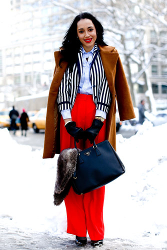 A statement-making mix of stripes, fiery red, and a posh Prada tote.
A statement-making mix of stripes, fiery red, and a posh Prada tote.