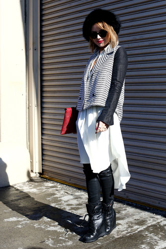 A leather-sleeved jacket and black legwear warmed (and edged) up a floaty white frock.
A leather-sleeved jacket and black legwear warmed (and edged) up a floaty white frock.