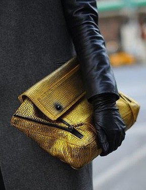 This gold number by 3.1 Phillip Lim is the perfect contrast against this gray coat.
This gold number by 3.1 Phillip Lim is the perfect contrast against this gray coat.