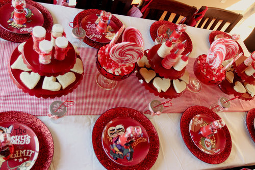 The decorating table was set up with red plates for eating and decorating, cookies waiting to be jazzed up, sprinkles, swirl lollipops, and more fun touches.
Source: Jenny Cookies
The decorating table was set up with red plates for eating and decorating, cookies waiting to be jazzed up, sprinkles, swirl lollipops, and more fun touches.
Source: Jenny Cookies