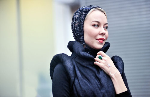 A printed head scarf also provides some chic and sensible protection from the rain.
A printed head scarf also provides some chic and sensible protection from the rain.