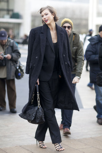 Karlie Kloss exuded effortless elegance leaving the shows in a classic suit and gorgeous, textured coat.
Karlie Kloss exuded effortless elegance leaving the shows in a classic suit and gorgeous, textured coat.