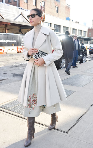 Creamy gray and white looked impossibly chic paired with posh boots on the streets outside the tents.
Creamy gray and white looked impossibly chic paired with posh boots on the streets outside the tents.