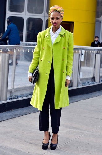 High-wattage outerwear and a multicolored turban lent statement power to a collared button-up and black trousers.
High-wattage outerwear and a multicolored turban lent statement power to a collared button-up and black trousers.