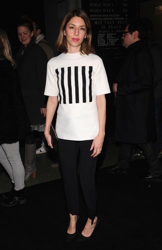 Sofia Coppola sat front row at Marc Jacobs in a striped tee and black cropped trousers.
Sofia Coppola sat front row at Marc Jacobs in a striped tee and black cropped trousers.