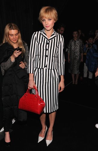 Jessica Stam sported a striped skirt suit with white pumps and a red bag at Marc Jacobs.
Jessica Stam sported a striped skirt suit with white pumps and a red bag at Marc Jacobs.