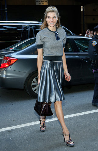 Jessica Hart paired a sporty short-sleeved sweatshirt with a metallic pleated skirt, a Louis Vuitton bag, and t-strap Yves Saint Laurent sandals en route to Calvin Klein.
Jessica Hart paired a sporty short-sleeved sweatshirt with a metallic pleated skirt, a Louis Vuitton bag, and t-strap Yves Saint Laurent sandals en route to Calvin Klein.