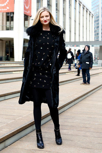 The all-over embellishment on this jet-black sheath drew us to this look outside the tents.
The all-over embellishment on this jet-black sheath drew us to this look outside the tents.