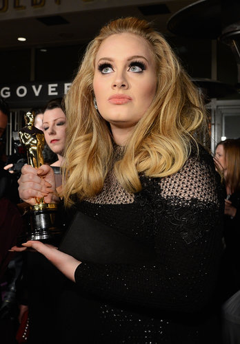 Adele held up her Oscar at the Governors Ball.
Adele held up her Oscar at the Governors Ball.