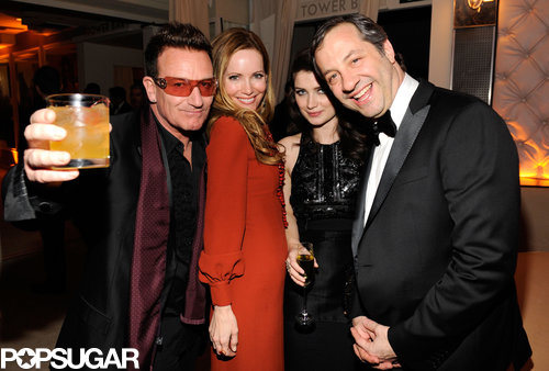 Bono raised his drink and posed with Leslie Mann, Eve Hewson, and Judd Apatow at the Vanity Fair party.
Bono raised his drink and posed with Leslie Mann, Eve Hewson, and Judd Apatow at the Vanity Fair party.