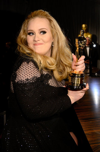 Adele posed with her Oscar.
Adele posed with her Oscar.