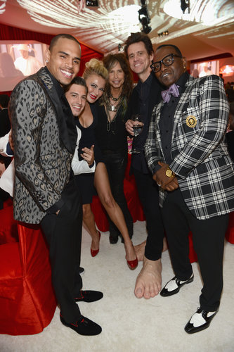 Jim Carrey and Randy Jackson hand fun with friends at Elton John's party on Oscar night.
Jim Carrey and Randy Jackson hand fun with friends at Elton John's party on Oscar night.