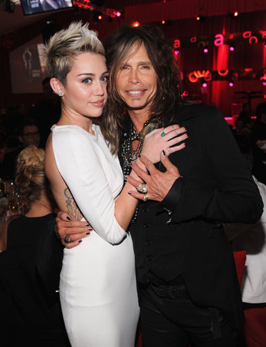 Miley Cyrus hugged Steven Tyler at Elton John's Oscar party.
Miley Cyrus hugged Steven Tyler at Elton John's Oscar party.