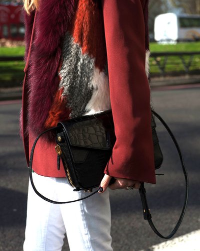 A sleek black croc bag was the perfect accompaniment to white jeans and a fur topper.
A sleek black croc bag was the perfect accompaniment to white jeans and a fur topper.
