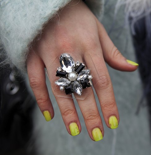 A statement ring popped against neon yellow nails.
A statement ring popped against neon yellow nails.