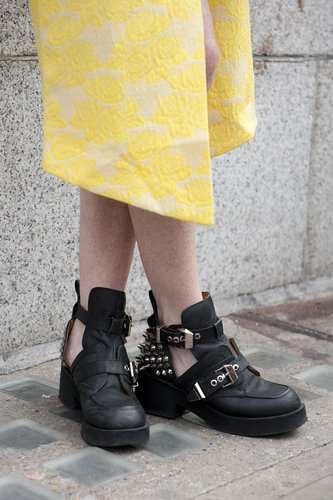 Cutout boots added a tough finish to this printed yellow skirt.
Cutout boots added a tough finish to this printed yellow skirt.