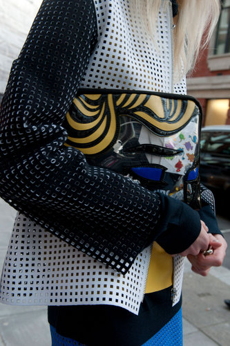 A laser-cut blazer got a dose of whimsy via a 3.1 Phillip Lim comic clutch.
A laser-cut blazer got a dose of whimsy via a 3.1 Phillip Lim comic clutch.