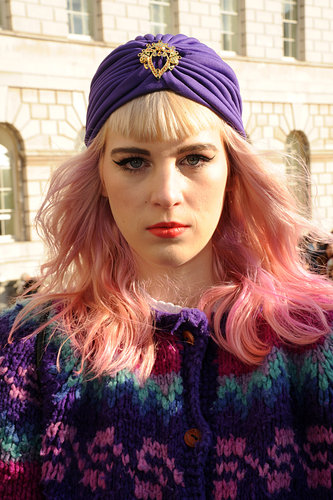 A purple jeweled turban finished off this eye-catching outfit.
A purple jeweled turban finished off this eye-catching outfit.
