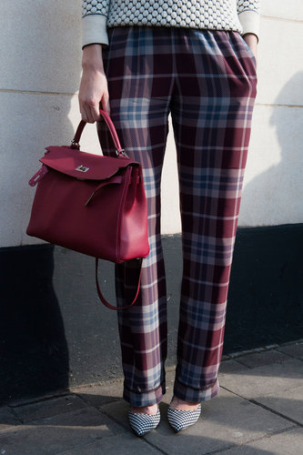 We love how this chic berry satchel popped against a pair of plaid trousers.
We love how this chic berry satchel popped against a pair of plaid trousers.
