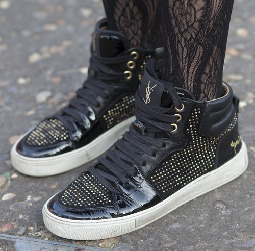 Bedazzled Yves Saint Laurent sneakers added a sporty tilt to lace hosiery.
Bedazzled Yves Saint Laurent sneakers added a sporty tilt to lace hosiery.