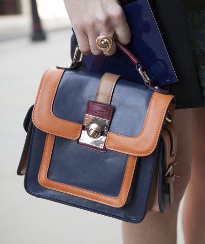 A LFW attendee completes her look with a two-toned mini satchel.
A LFW attendee completes her look with a two-toned mini satchel.