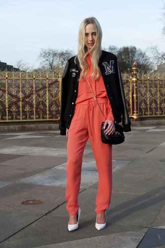 This attendee played up the sporty vibe of her draw-string pants with an athletic-inspired varsity jacket, then countered with sleek white pumps.
This attendee played up the sporty vibe of her draw-string pants with an athletic-inspired varsity jacket, then countered with sleek white pumps.