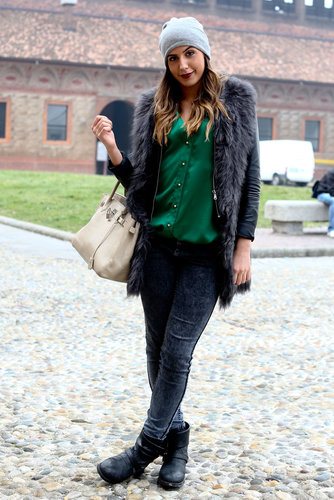 Street chic Milano style, with a luxe furry coat to counter her biker boots.
Street chic Milano style, with a luxe furry coat to counter her biker boots.