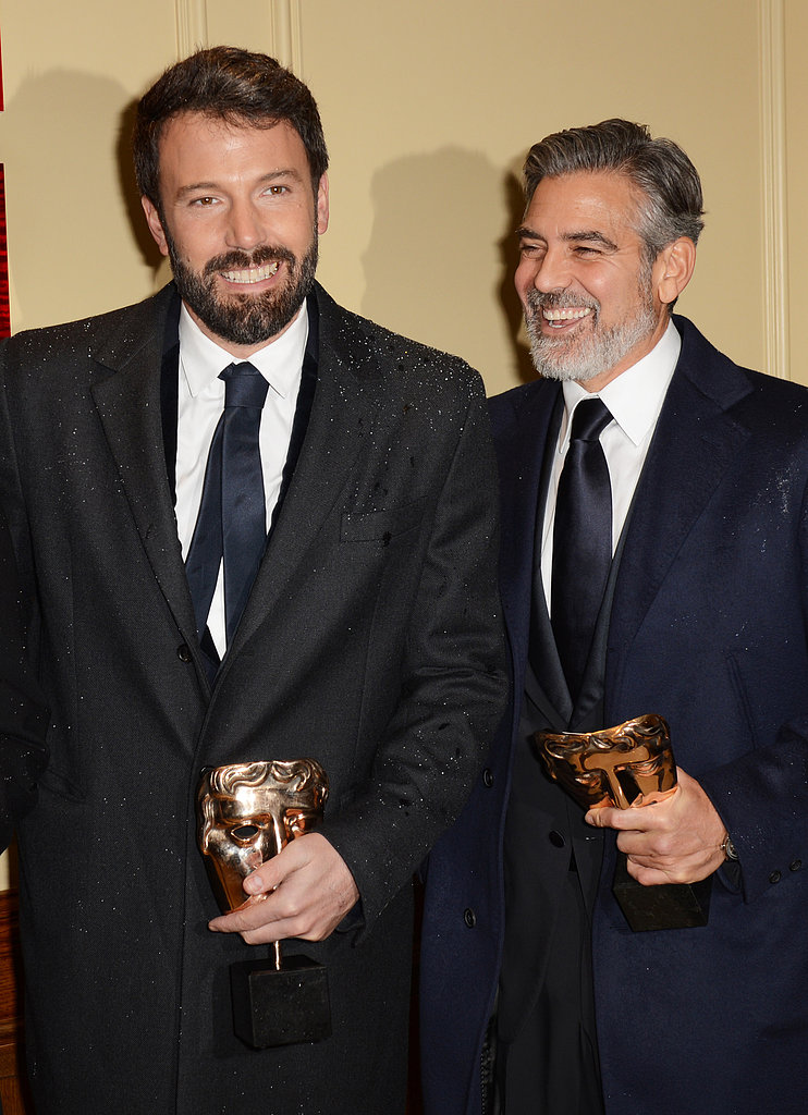 Ben Affleck and George Clooney smiled while holding their BAFTA Awards.
Ben Affleck and George Clooney smiled while holding their BAFTA Awards.