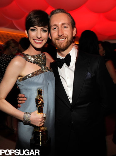 Anne Hathaway brought her husband, Adam Shulman, and her Oscar to the Vanity Fair after-party.
Anne Hathaway brought her husband, Adam Shulman, and her Oscar to the Vanity Fair after-party.