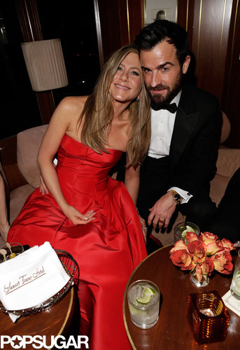 Jennifer Aniston cuddle up to fiancé Justin Theroux at Vanity Fair's Oscar after-party.
Jennifer Aniston cuddle up to fiancé Justin Theroux at Vanity Fair's Oscar after-party.