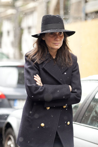 Emmanuelle Alt showed off her signature style in a military coat and a fedora.
Emmanuelle Alt showed off her signature style in a military coat and a fedora.
