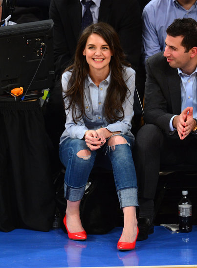 Katie Holmes styled a chambray shirt with distressed boyfriend jeans and punchy neon pumps while cheering on the New York Knicks at Madison Square Garden.
Katie Holmes styled a chambray shirt with distressed boyfriend jeans and punchy neon pumps while cheering on the New York Knicks at Madison Square Garden.