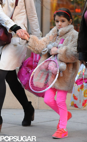 Suri Picks Up a Pink Racket For Tennis With Katie Holmes Suri Picks Up a Pink Racket For Tennis With Katie Holmes