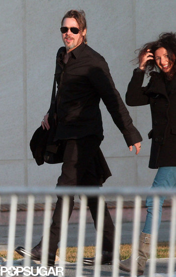 Brad Pitt walked with a group of pals out of the airport. Brad Pitt walked with a group of pals out of the airport.