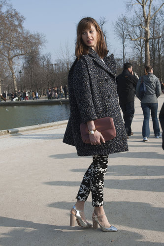 The textural play between her coat and trousers was a chic combo unto itself; the footwear just furthered the appeal.
The textural play between her coat and trousers was a chic combo unto itself; the footwear just furthered the appeal.