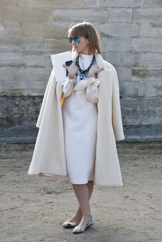 Statement jewels and serene blue mirrored shades popped against all white.
Statement jewels and serene blue mirrored shades popped against all white.