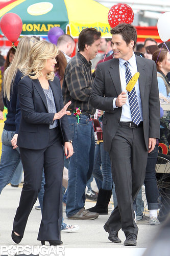 Amy Poehler and Rob Lowe filmed scenes at a carnival.
Amy Poehler and Rob Lowe filmed scenes at a carnival.