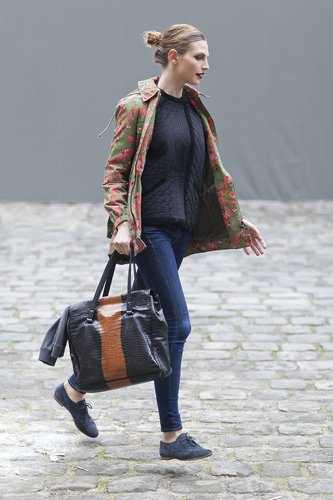 A floral print on this showgoer's anorak brightened up her head-to-toe style.
A floral print on this showgoer's anorak brightened up her head-to-toe style.