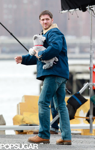 Tom Hardy Cuddles Up to a Canine Costar on Set Tom Hardy Cuddles Up to a Canine Costar on Set
