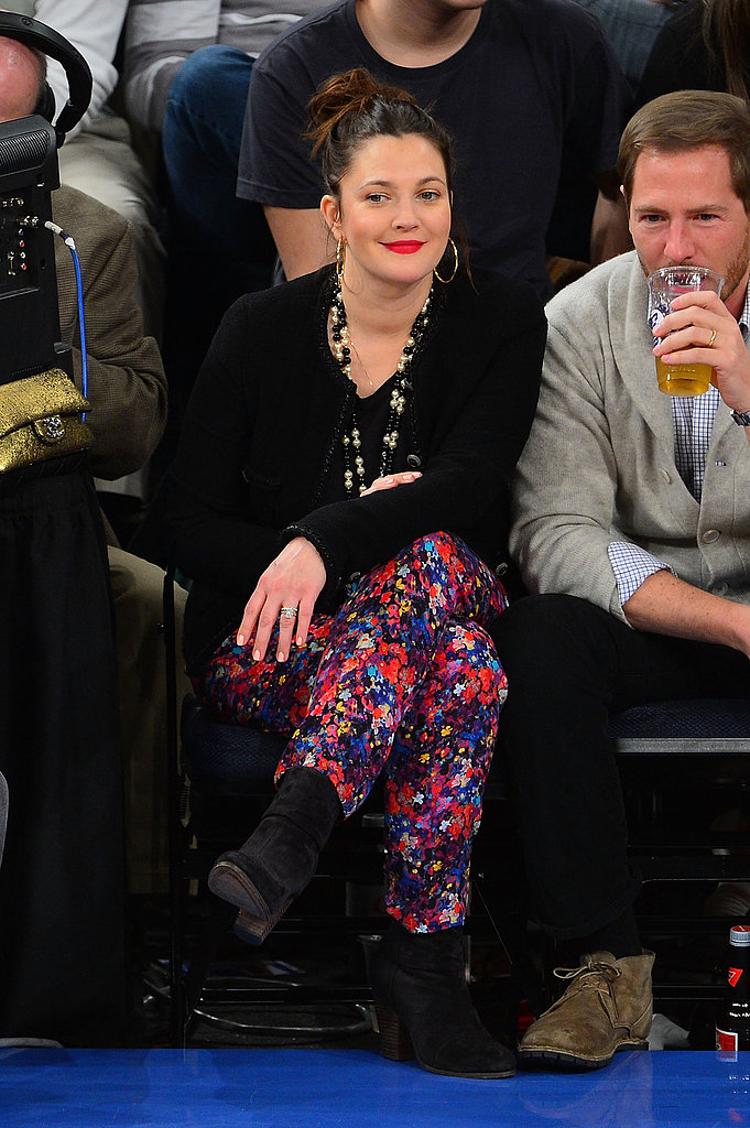 Drew Barrymore's floral-print pants and sweep of bright lipstick stole the show during a January 2013 Knicks game.
Drew Barrymore's floral-print pants and sweep of bright lipstick stole the show during a January 2013 Knicks game.