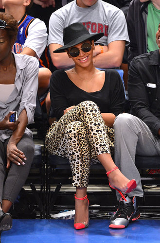 Beyoncé showed off fierce sideline style in April 2012, wearing a pair of leopard-print pants, hot-pink Christian Louboutins, and a wide-brimmed hat.
Beyoncé showed off fierce sideline style in April 2012, wearing a pair of leopard-print pants, hot-pink Christian Louboutins, and a wide-brimmed hat.