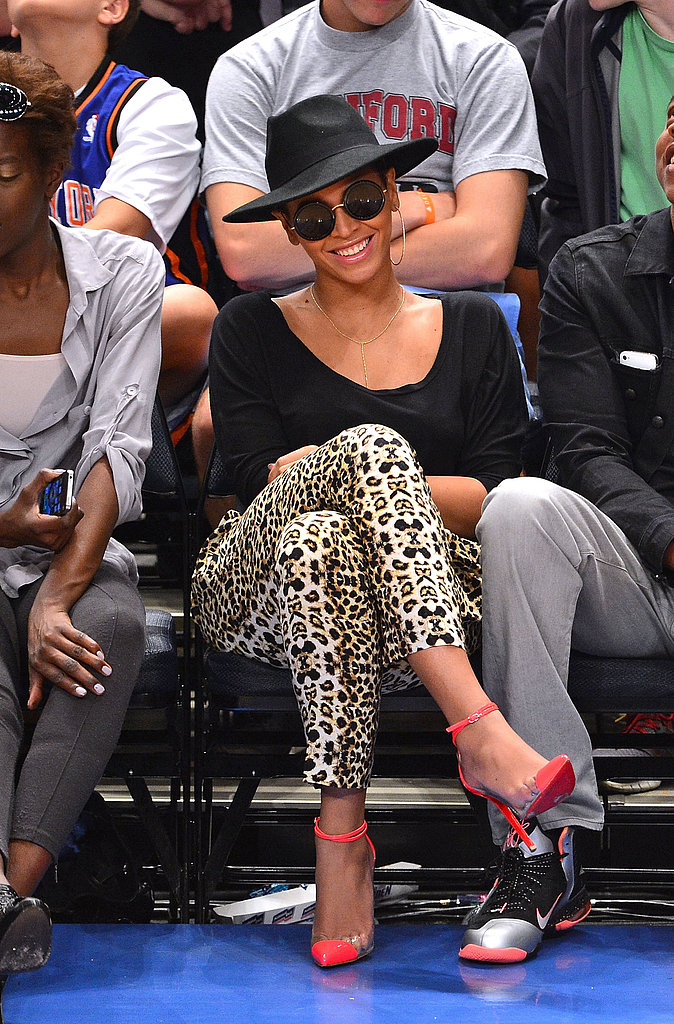 Beyoncé showed off fierce sideline style in April 2012, wearing a pair of leopard-print pants, hot-pink Christian Louboutins, and a wide-brimmed hat.
Beyoncé showed off fierce sideline style in April 2012, wearing a pair of leopard-print pants, hot-pink Christian Louboutins, and a wide-brimmed hat.