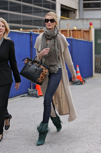 Rosie Huntington-Whiteley layered up in a long cardigan, a leopard bag, and fringe booties in LA.
Rosie Huntington-Whiteley layered up in a long cardigan, a leopard bag, and fringe booties in LA.