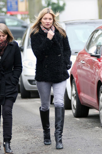Kate Moss kept her shearling coat and gray jeans unique with a printed scarf and knee-high boots.
Kate Moss kept her shearling coat and gray jeans unique with a printed scarf and knee-high boots.
