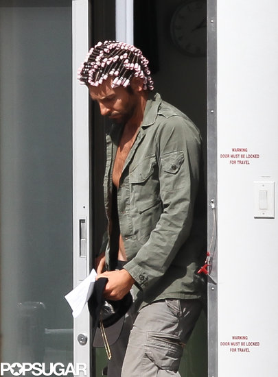 Bradley Cooper wore curlers in his hair on set in Boston.
Bradley Cooper wore curlers in his hair on set in Boston.