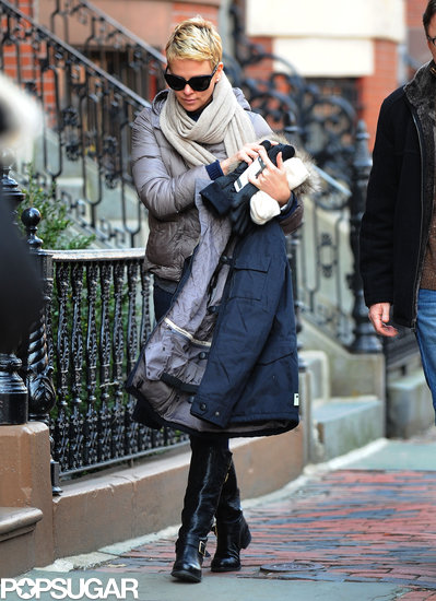 Charlize Theron wore tall black boots. Charlize Theron wore tall black boots.
